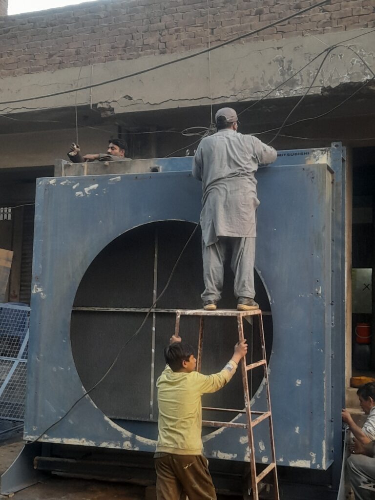 OUR EMPLOYS DOING SERVICE OF 2MEGAWATT GENSET RADIATOR